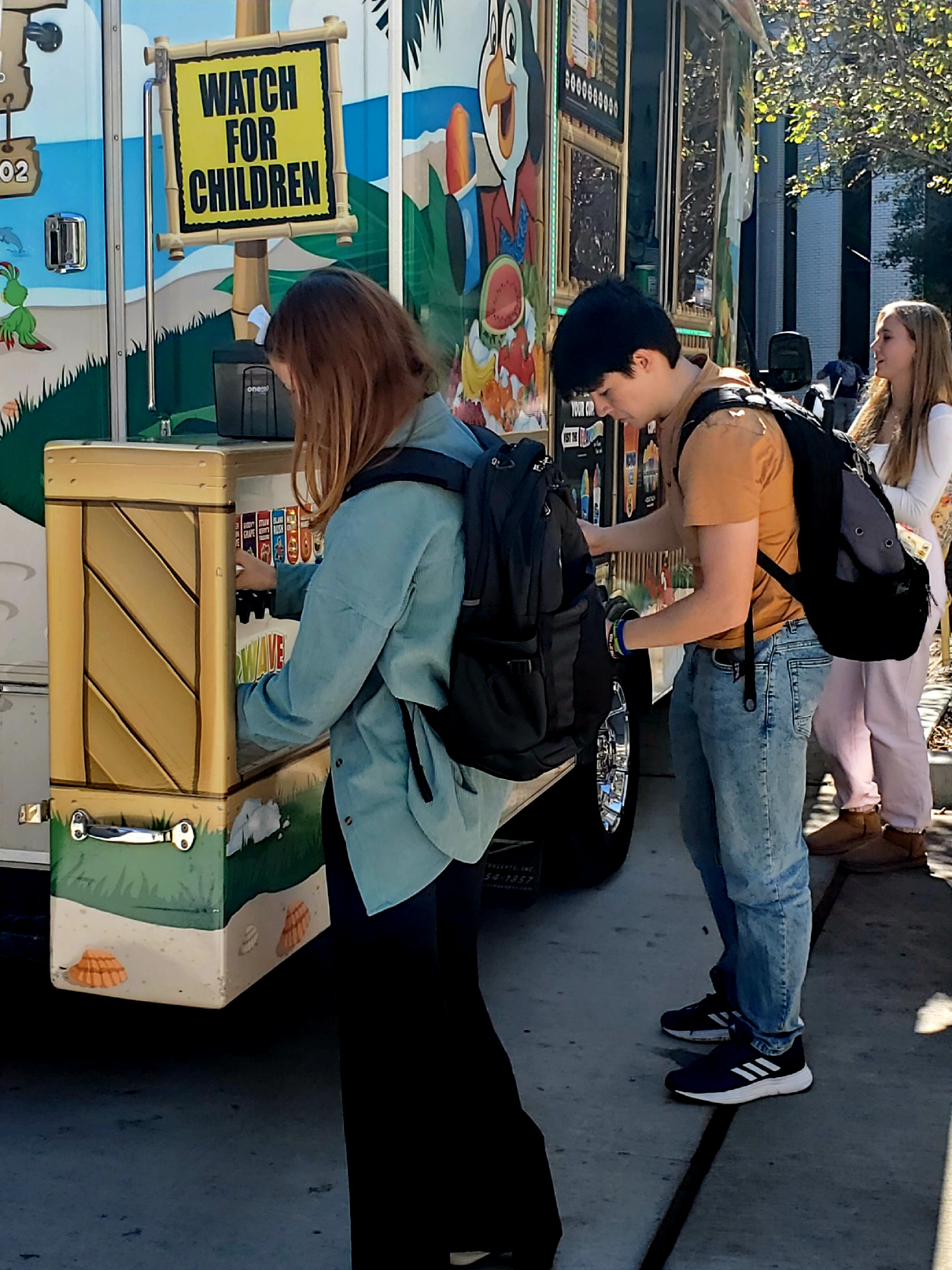 Students getting flavors for the snow cone of choice